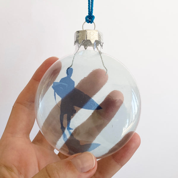 blue surfer standing