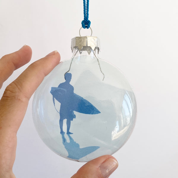 blue surfer standing