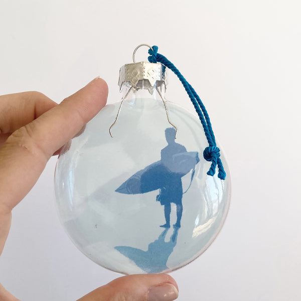 blue surfer standing